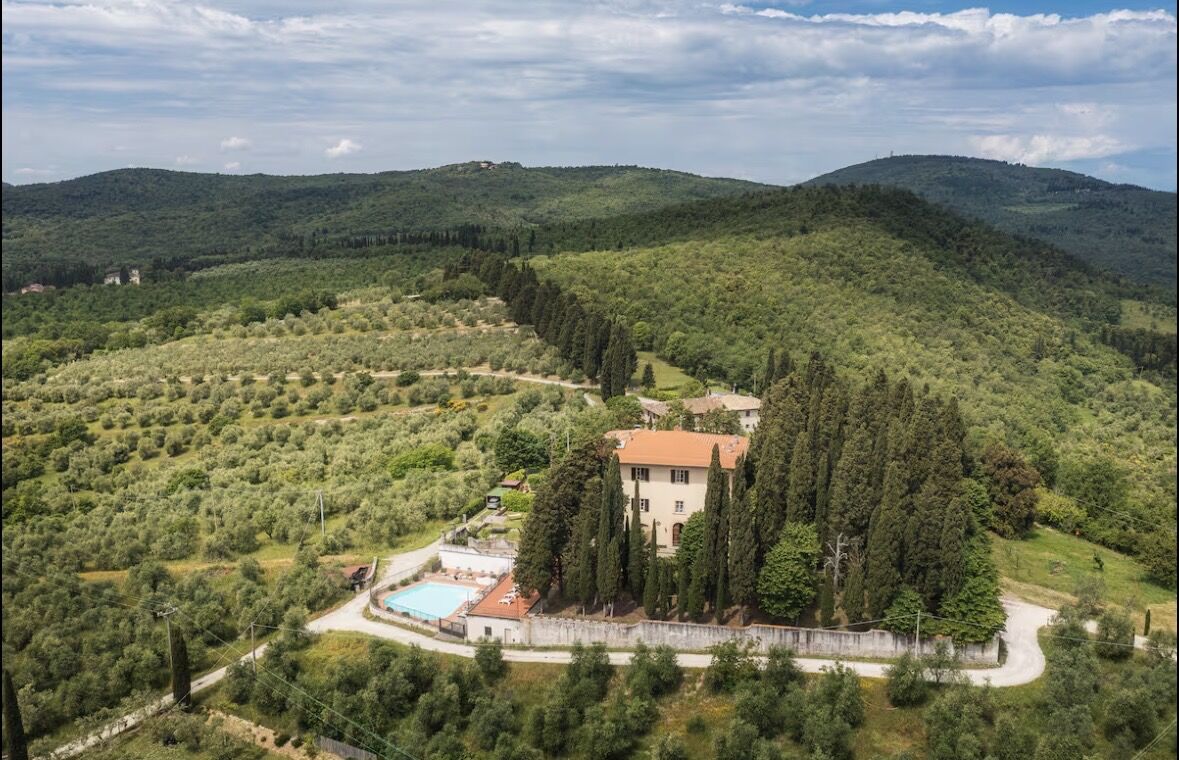Aerial view of the villa nestled in the Tuscan hills